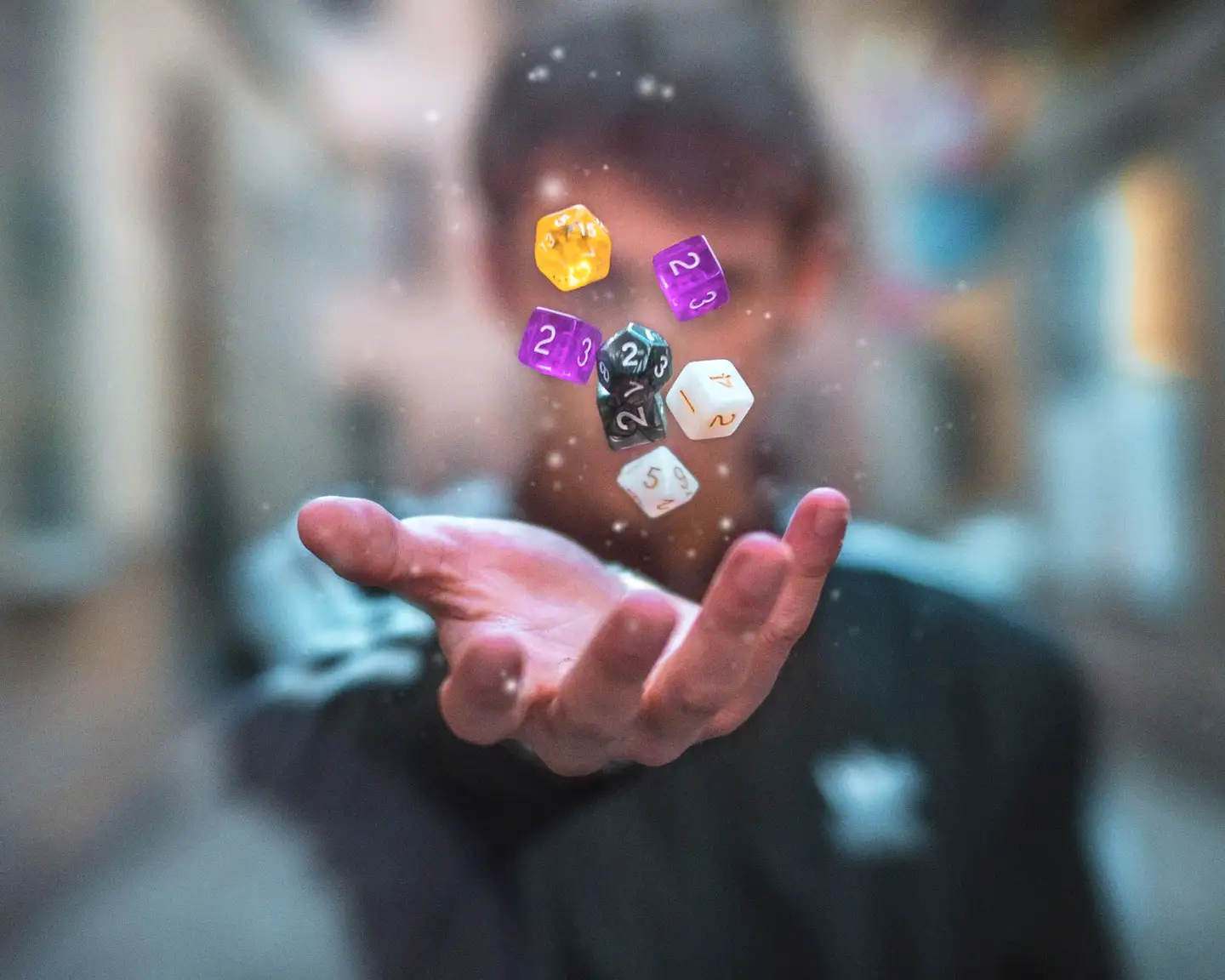 Sparkle-filled resin dice catching the light